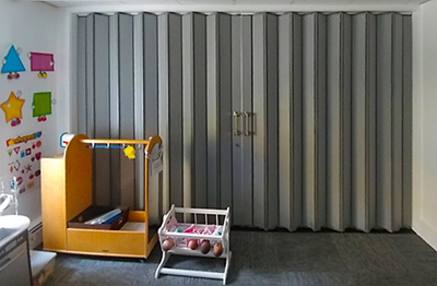 Playroom with accordion sound proof door
